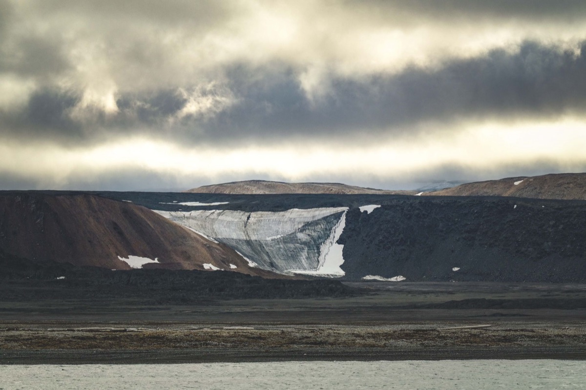 Radig Island terrain features with rocky outcrops and dense undergrowth
